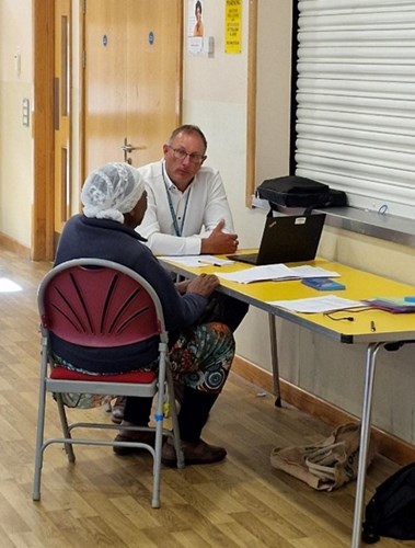 Housing officer talking to tenant